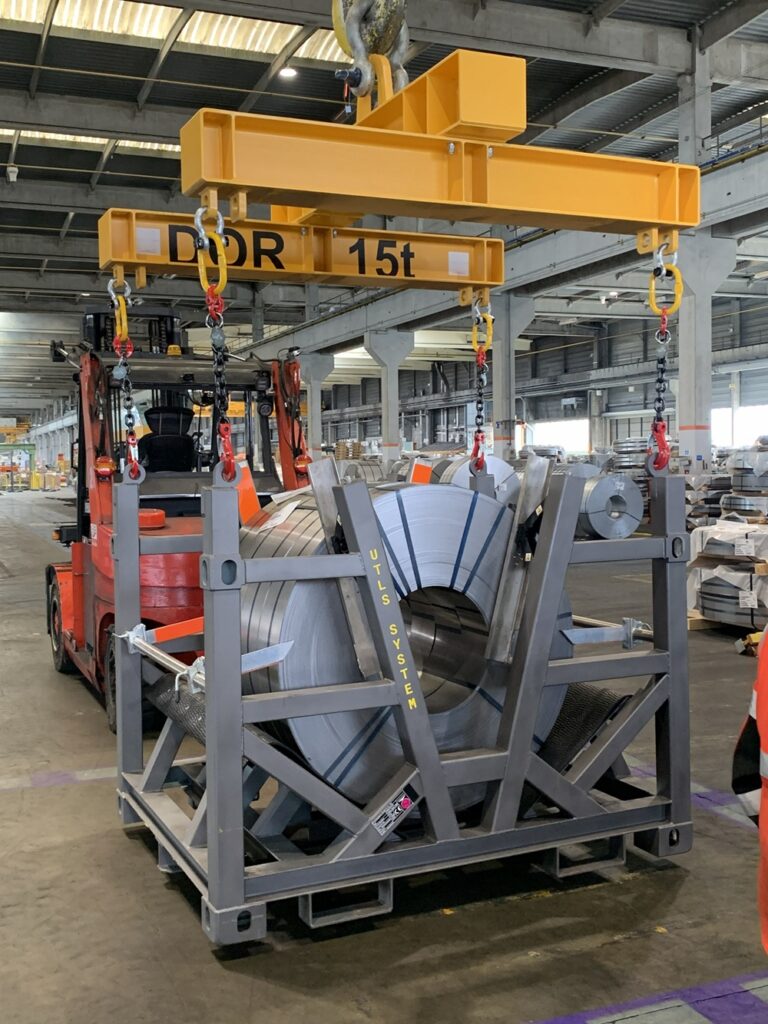 Transportation of slit coils in UTLS Systems coil rack with Vario lifting beam for loading onto truck or trailer.