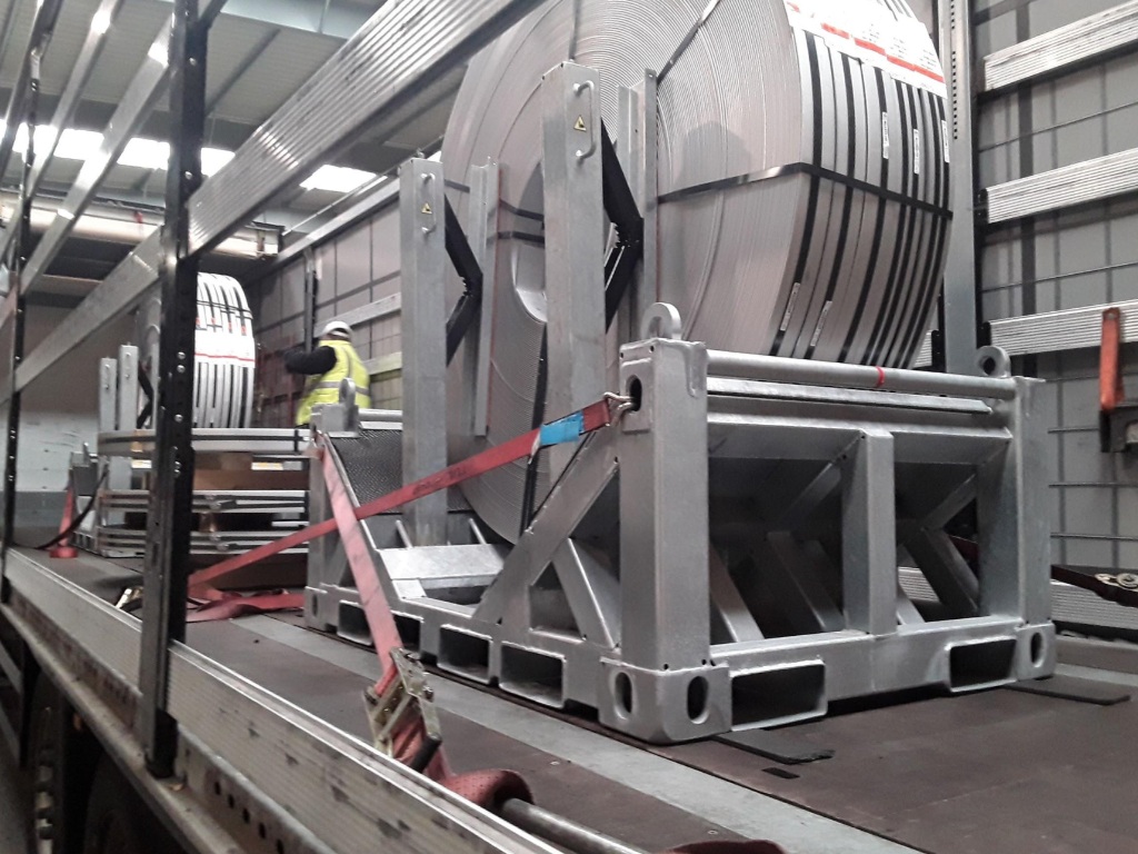 UTLS Systems coil transportation rack with UTLS stanchions Vario. For safe truck transport of slit coils.