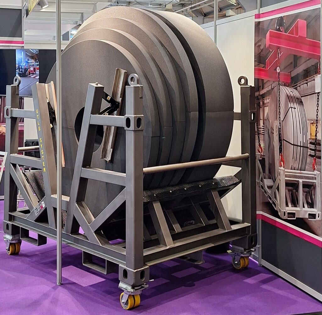 UTLS Systems coil transportation rack with UTLS stanchions Vario and trolley FR5, which is easily mounted with the help of Twistlock in the rack's ISO Container corner system. Picture from EuroBlech 2024.